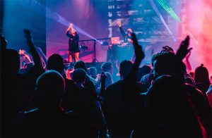 Photo of performers on stage at a club
