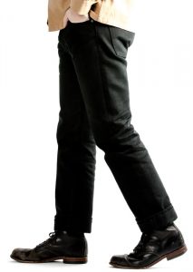 Photo of a person's legs wearing black pants