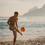 Person playing soccer in Rio<br /> Photo by Marcos Paulo Prado on Unsplash