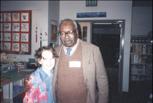 Lawrence with a young student