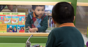 Child looking in mirror
