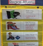 rules for playing outside color-coded and listed in both English and Spanish, for instance, "Feet first going down the slide." Each rule has an accompanying cartoon image.