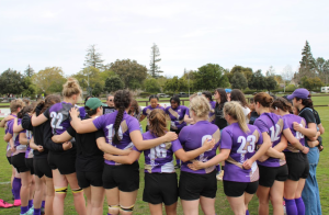 The team forms a huddle following a game at the CRAA D1 College Rugby Western Regional Championships. Despite the recent loss, they gather to uplift one another and analyze the game's highlights | Photo from University Rugby Cub CC BY