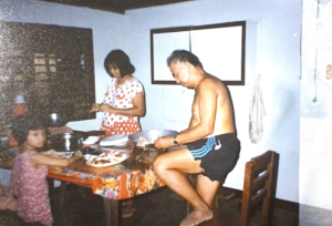 Grandpa Buddy butchering meat at the dining table