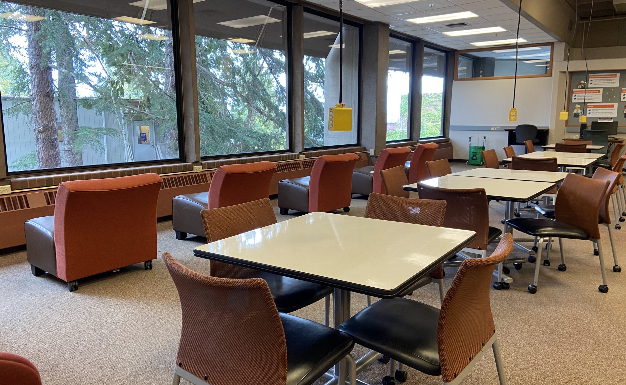 tables and chairs facing window